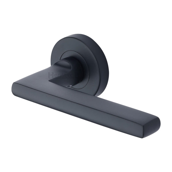 Heritage Brass Trident Door Handle on Round Rose