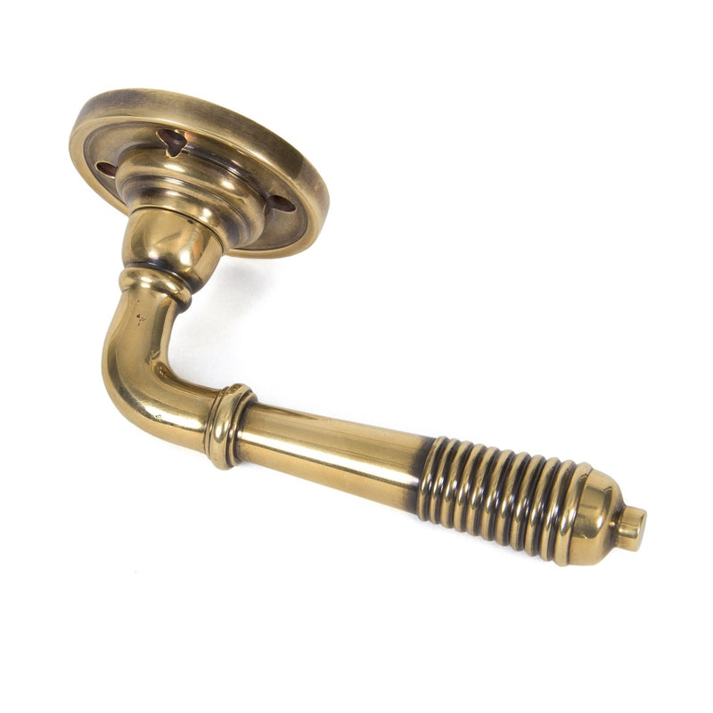 From The Anvil Reeded Lever Handles on Round Rose - Aged Brass