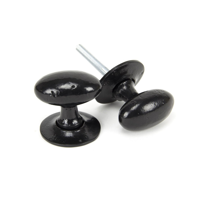 From The Anvil Oval Knob Handles on Round Rose - Black