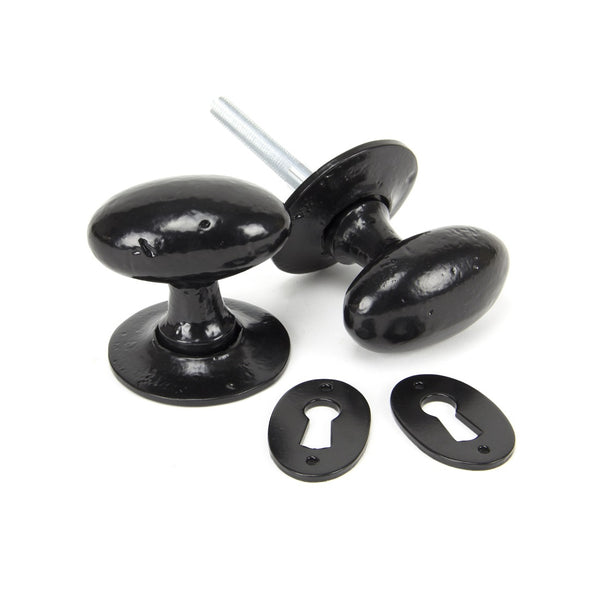From The Anvil Oval Knob Handles on Round Rose - Black