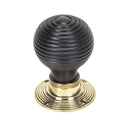 From The Anvil Beehive Knob Handles on Round Rose - Ebony & Aged Brass