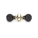 From The Anvil Beehive Knob Handles on Round Rose - Ebony & Aged Brass