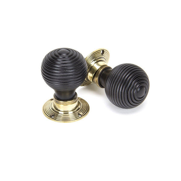 From The Anvil Beehive Knob Handles on Round Rose - Ebony & Aged Brass
