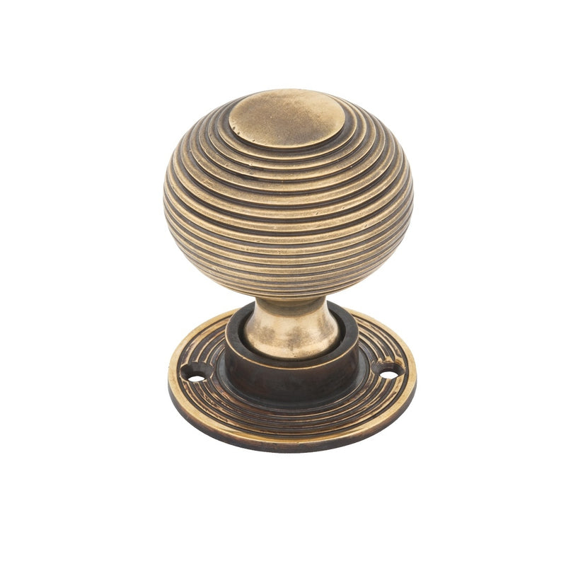 From The Anvil Beehive Heavy Knob Handles on Round Rose - Aged Brass
