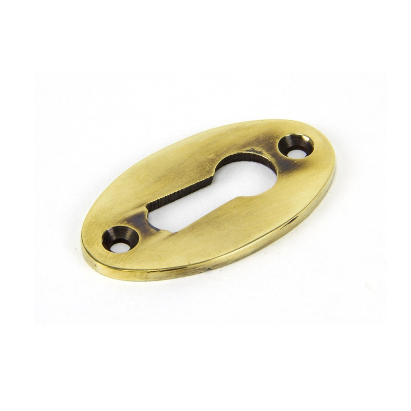 From The Anvil Period Lever Key Oval Escutcheon - Aged Brass