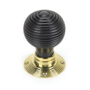 From The Anvil Beehive Knob Handles on Round Rose - Ebony & Polished Brass