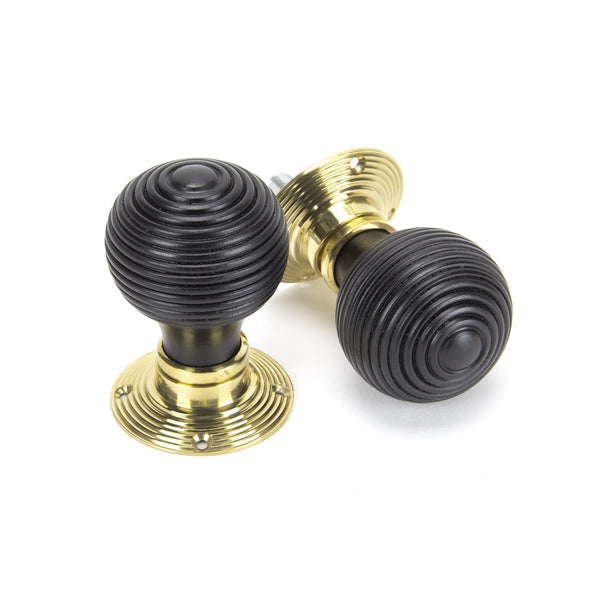 From The Anvil Beehive Knob Handles on Round Rose - Ebony & Polished Brass