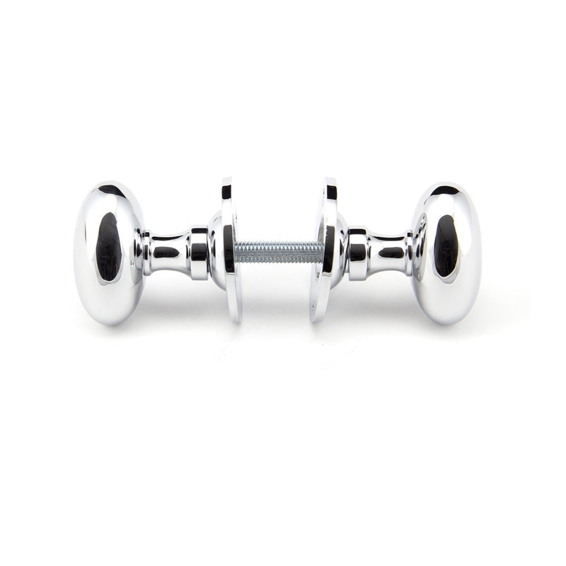 From The Anvil Oval Knob Handles on Round Rose - Polished Chrome