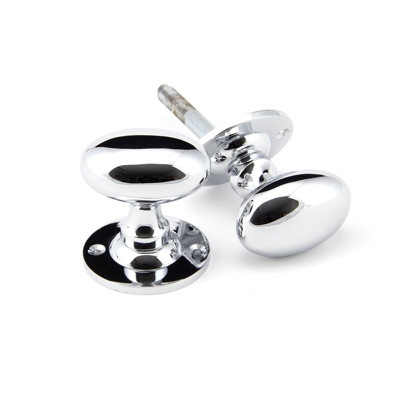 From The Anvil Oval Knob Handles on Round Rose - Polished Chrome