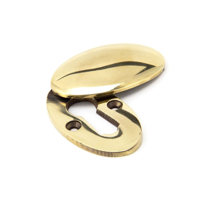 From The Anvil Lever Key Oval Covered Escutcheon - Aged Brass