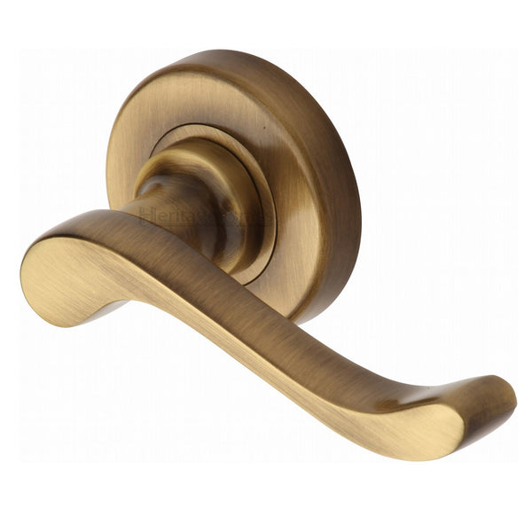 M.Marcus Bedford Lever Handles on Round Rose - Antique Brass